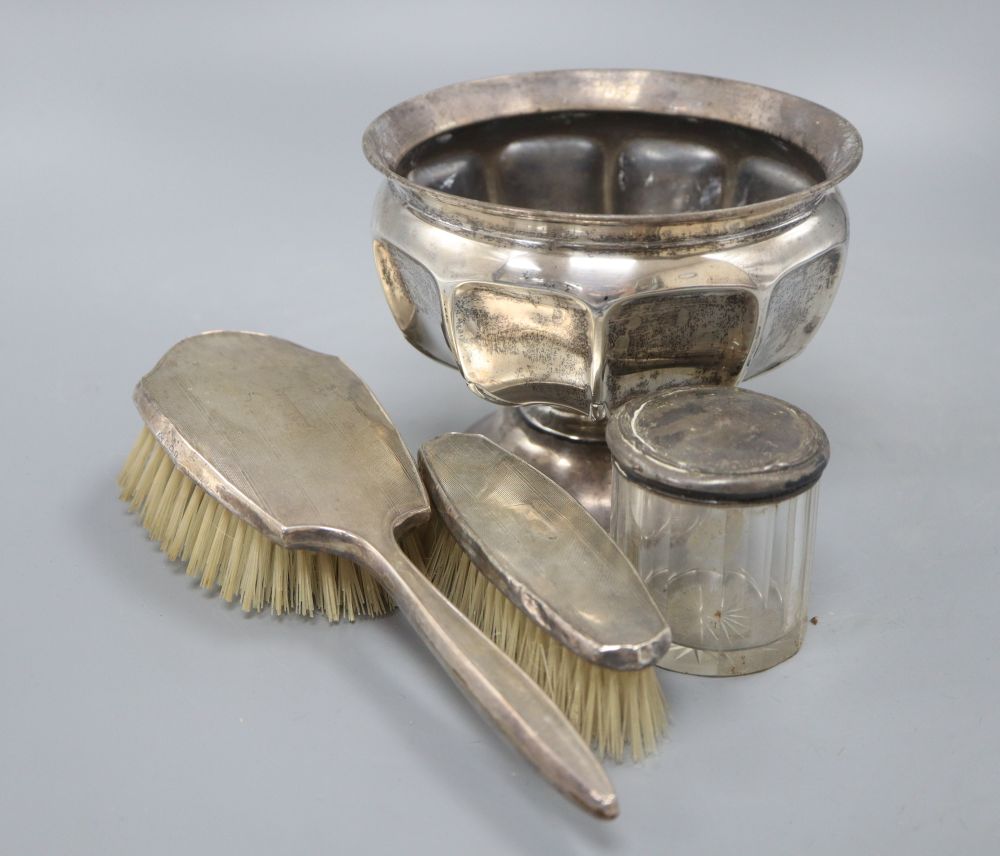 A small silver rose bowl, two brushes and a jar, 648 grams gross